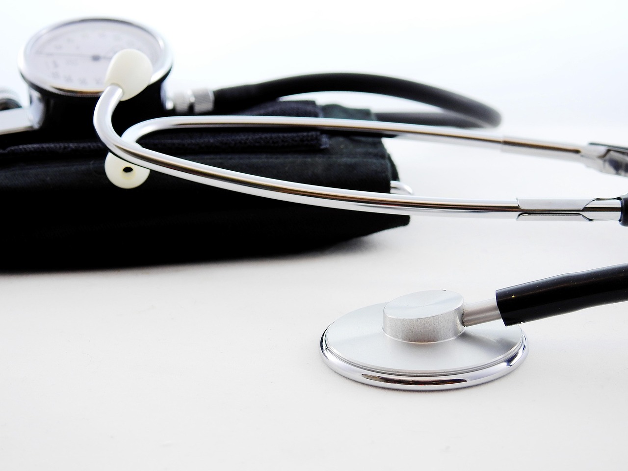 Blood pressure cuff and stethoscope on a white background
