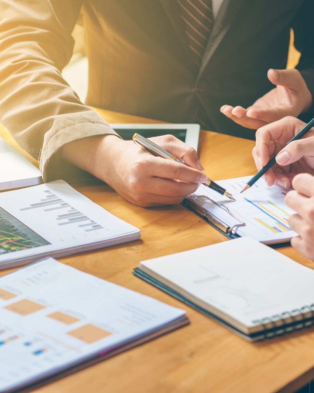 Advisor and client reviewing plan comparison charts