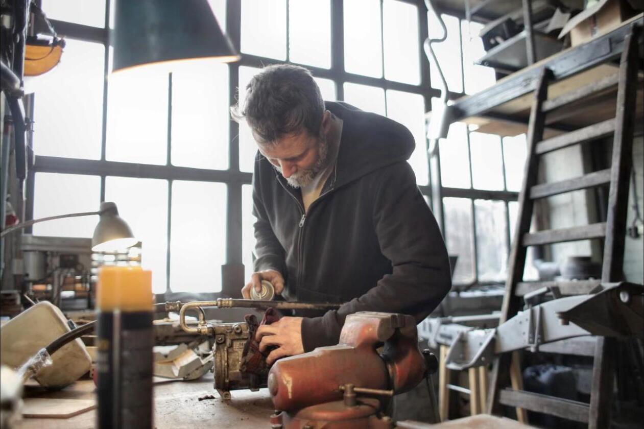 Independent tradesperson working in his shop