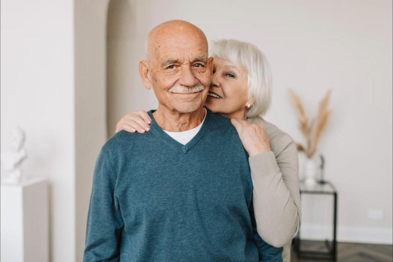 Senior couple smiling together at home
